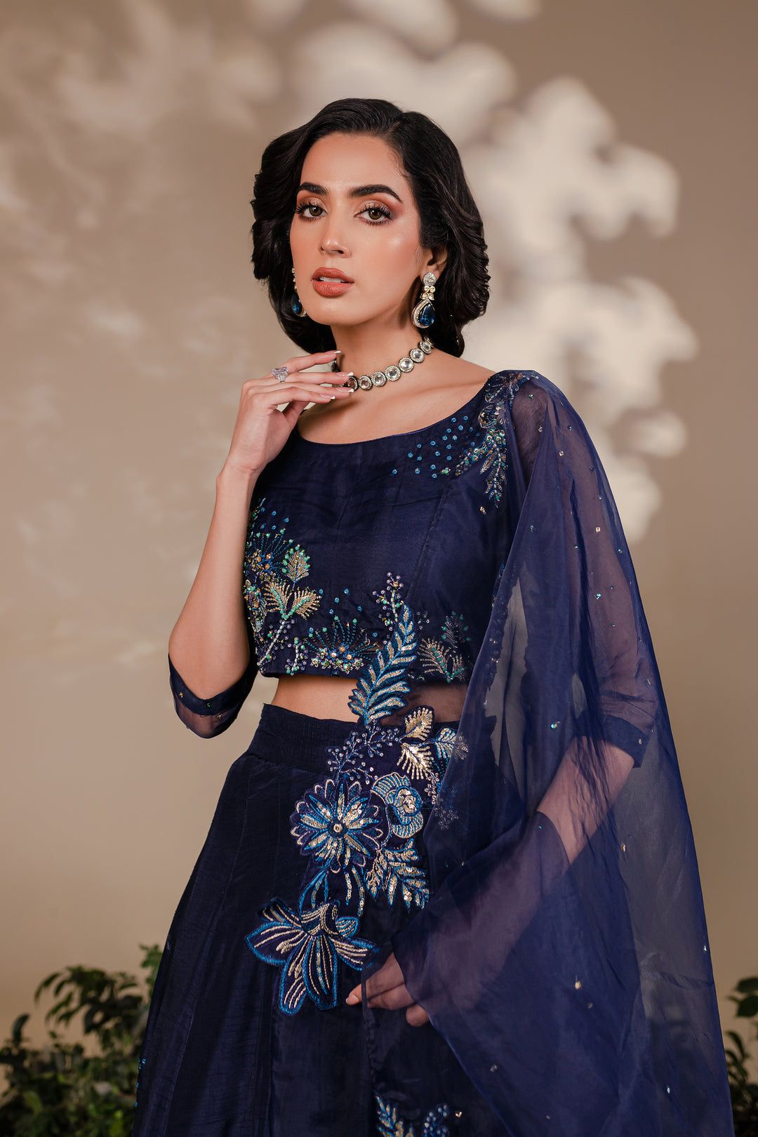 Close-up of Batik Arden 3 Piece choli showing handwork embroidery in gold and blue on navy organza with matching dupatta.