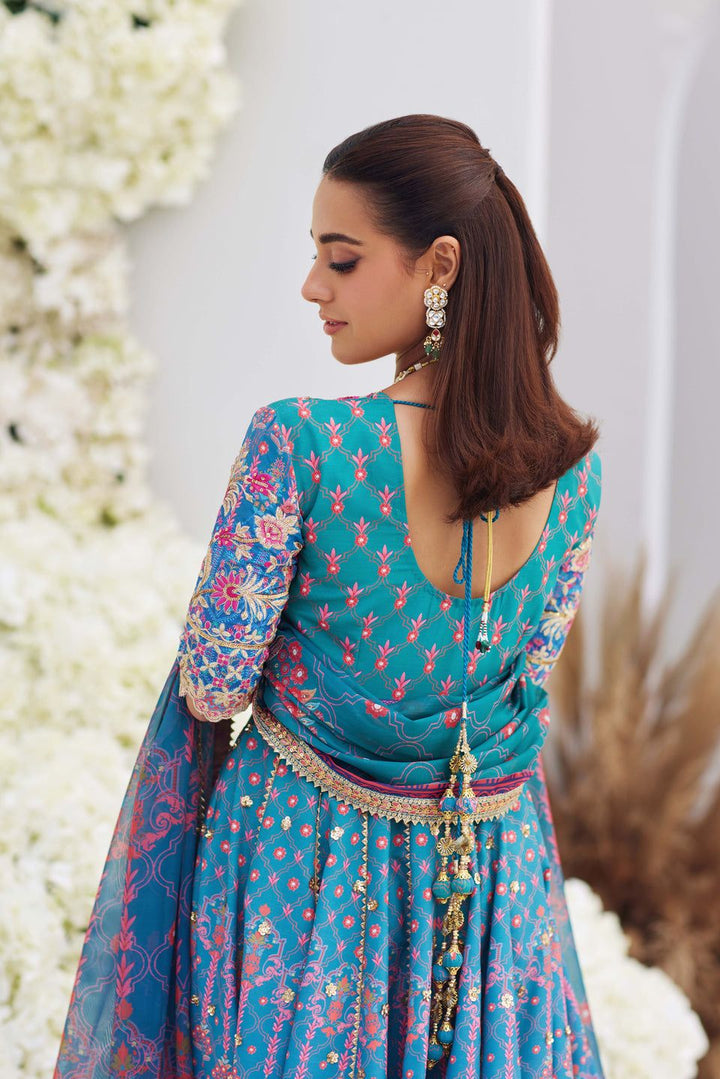 Back view of Mina Hasan blue embroidered shirt with tassel detailing, showcasing intricate sleeve and back embroidery in floral motifs.