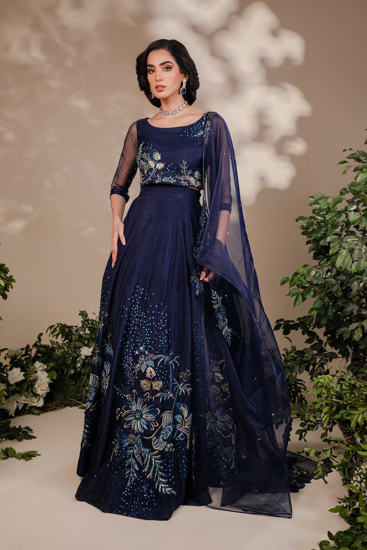 Batik Arden 3 Piece formal dress featuring navy blue organza choli with gold and light blue embroidery, paired with raw silk lehnga and dupatta.
