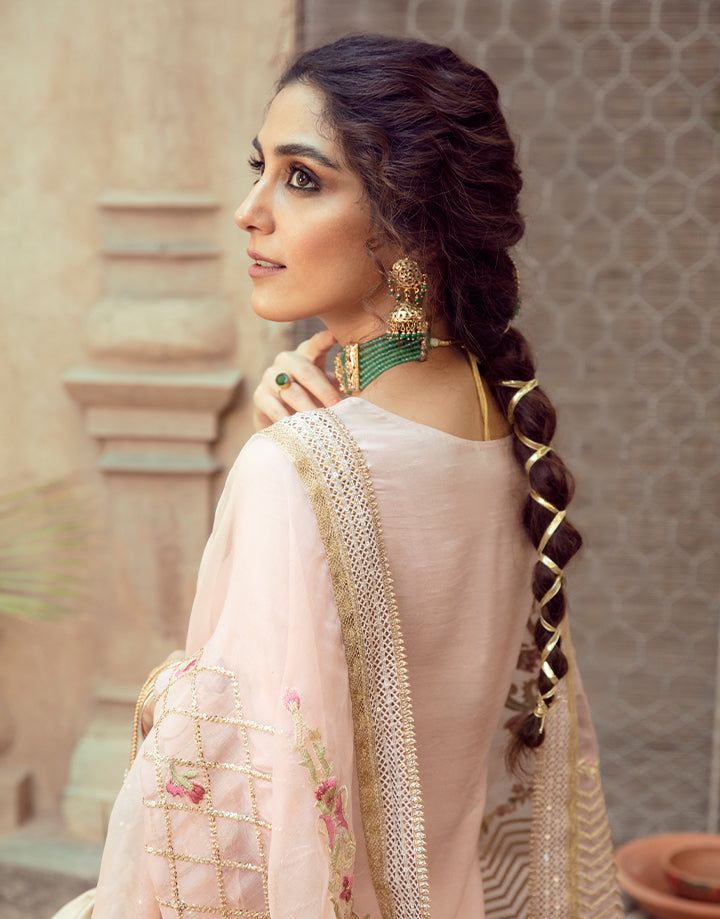 Close-up of Faiza Saqlain Gulfam showcasing intricate embroidery on dupatta and elegant styling with traditional jewelry.