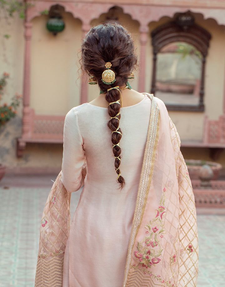 Rear view of Faiza Saqlain Gulfam ensemble highlighting floral embroidery and delicate gold detailing on the dupatta.