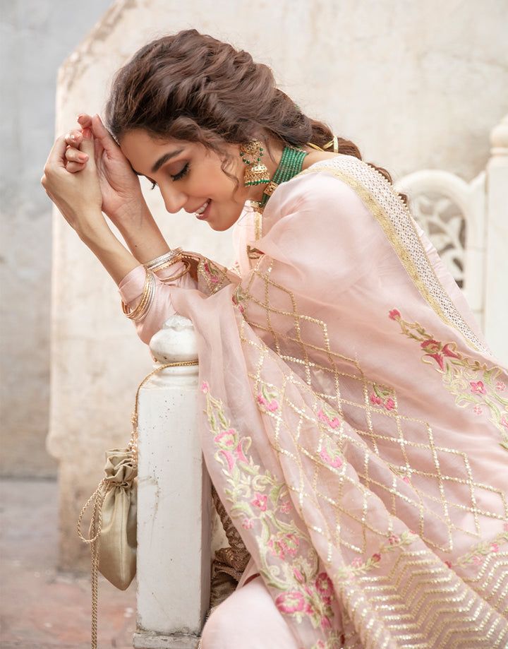 Faiza Saqlain Gulfam Korean raw silk outfit with gold and pink embroidered dupatta, styled for a bridal trousseau look.