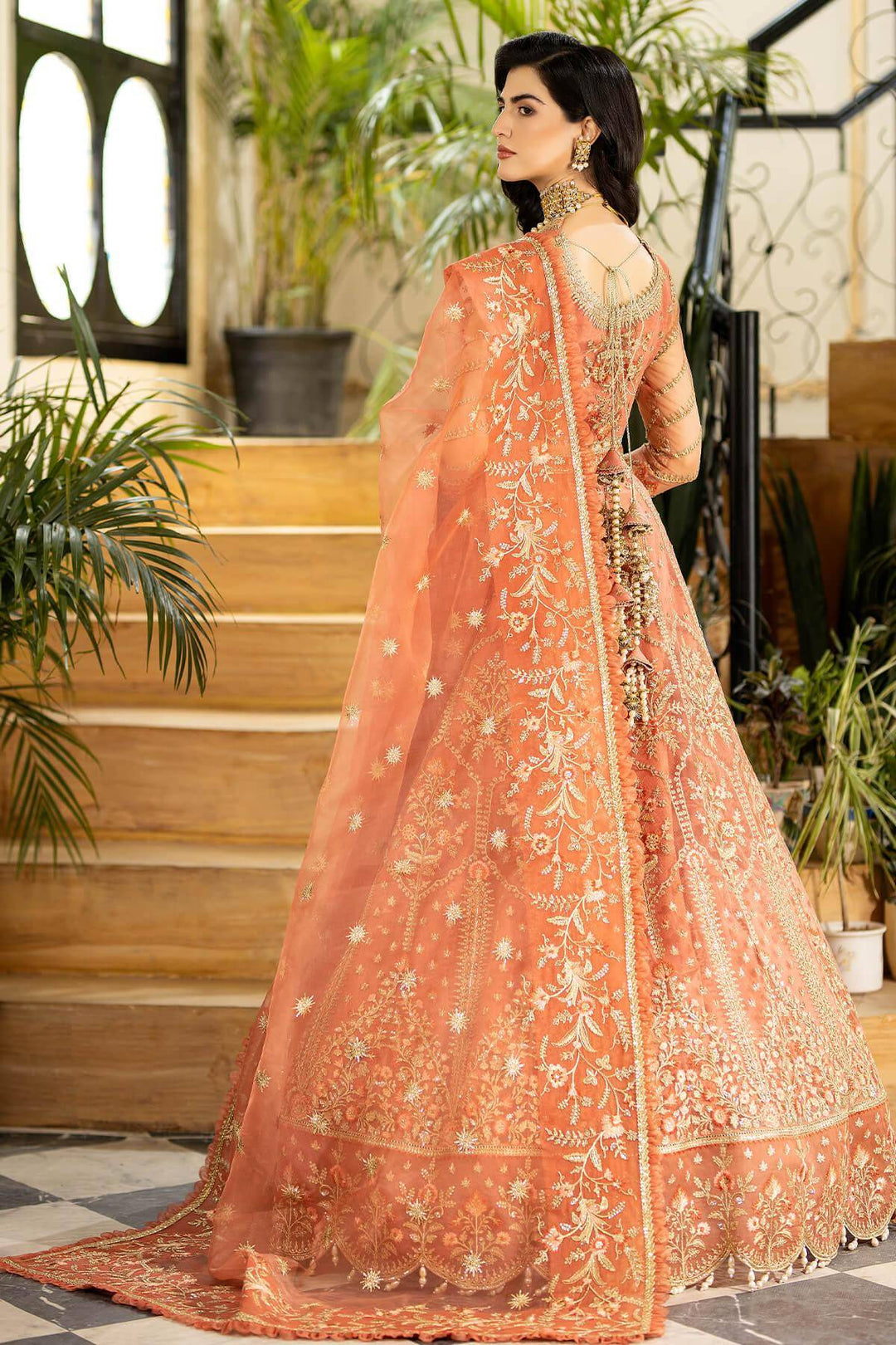 Back view of pink gown with floral embroidery