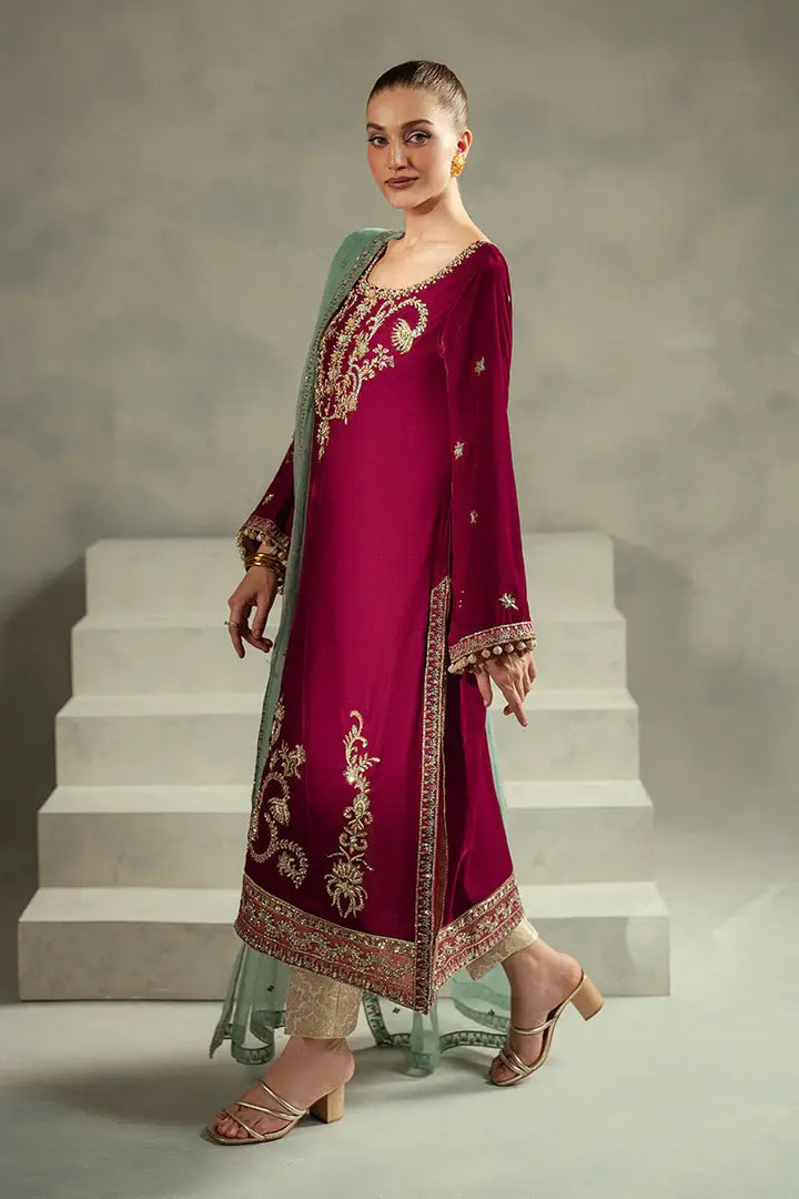 Side profile of MUSHQ Velvet - Ruby Maroon Shirt Set with gold embroidered motifs and jamawar trousers for a regal look.