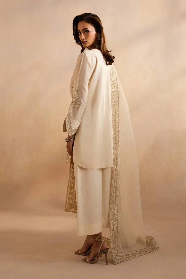 Back view of beige Maryum and Maria Alice outfit with embroidered organza dupatta draped over shoulder, highlighting traditional craftsmanship.