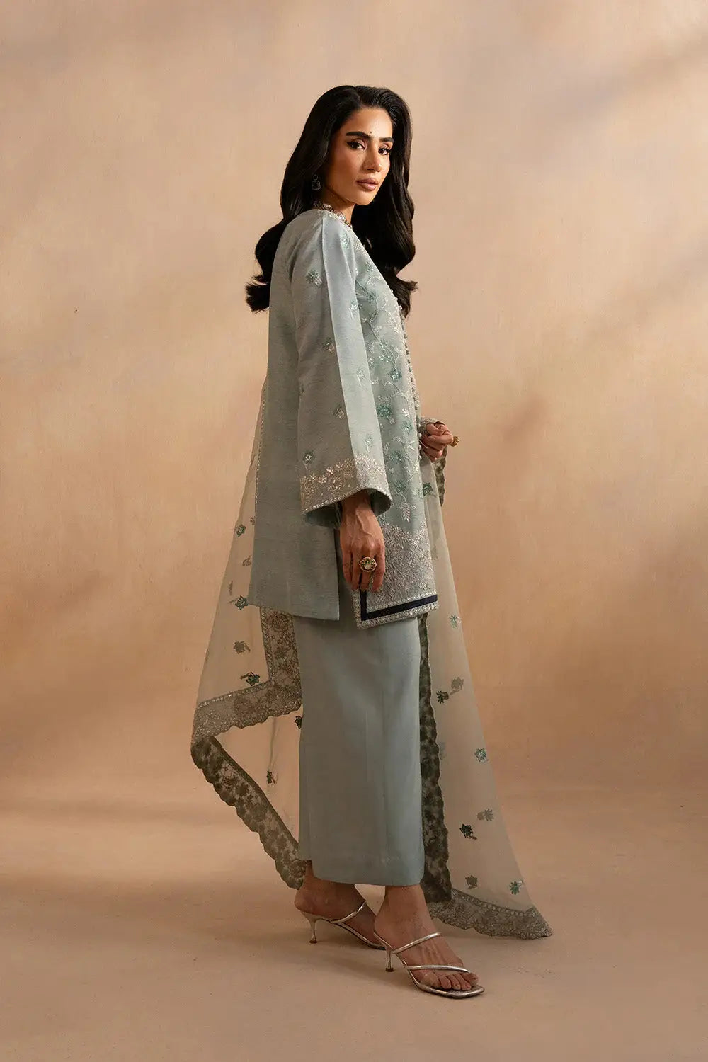 Elegant front view of Maryum N Maria Evelyn Pakistani outfit with intricate embroidery and sheer dupatta in a refined blue-grey shade.