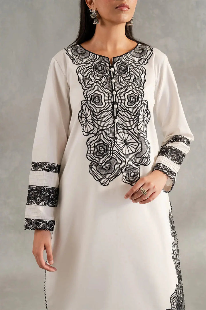 Close-up of SIENNA - MS50417 lawn shirt highlighting intricate black floral embroidery and button detailing on the neckline and sleeves.