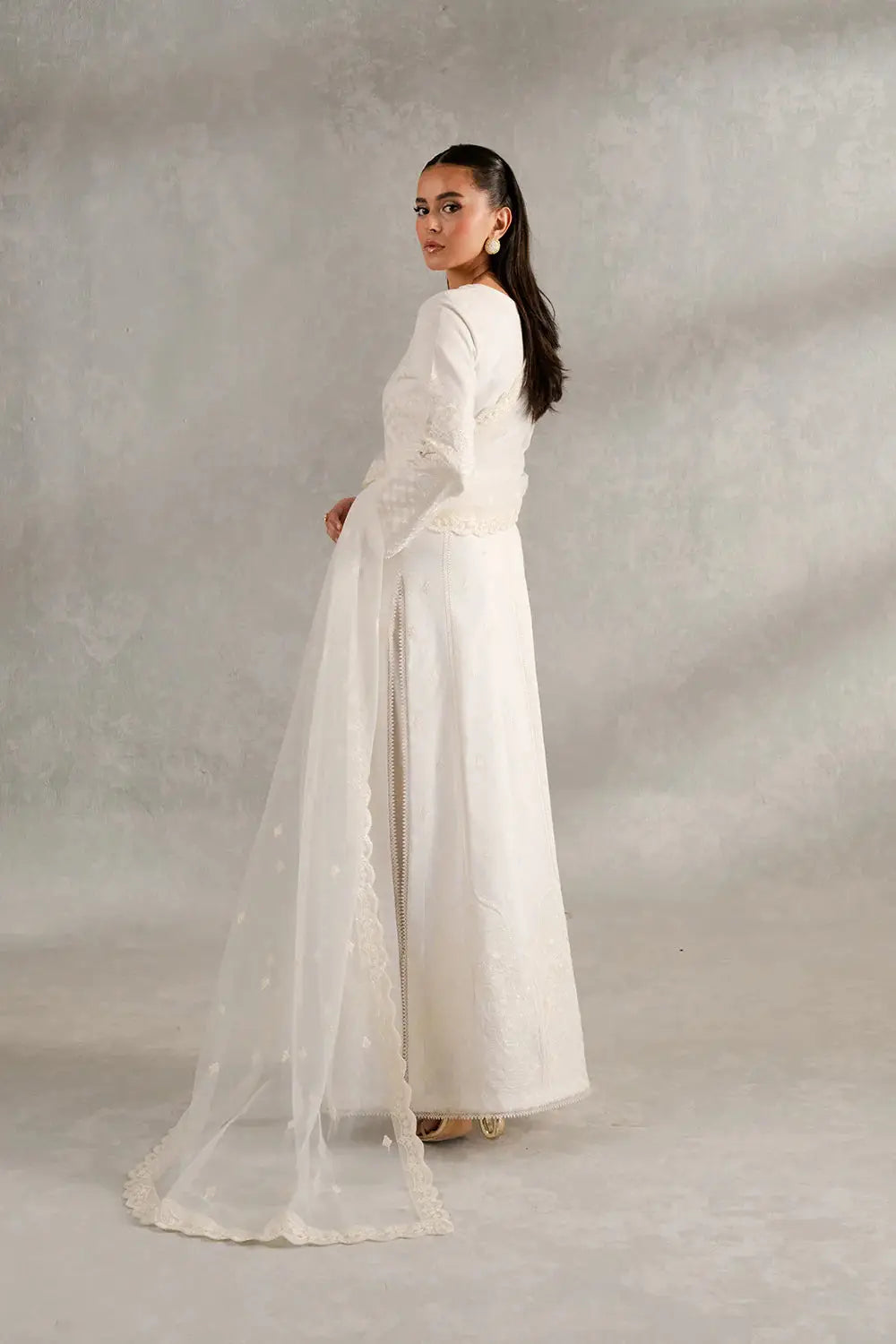 Back view of ESME MS50418 White Women Three PC highlighting the flowy net dupatta and intricate embroidery on the shirt and trousers.