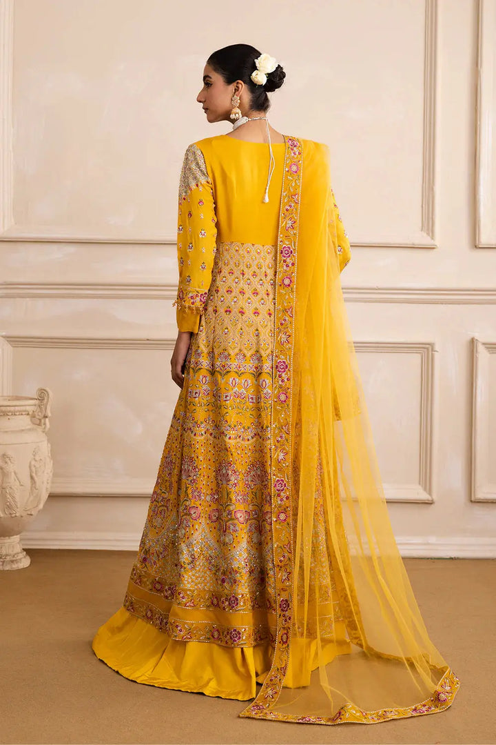 Back view of MARYUM N MARIA ZARINA yellow Anarkali outfit featuring embroidered dupatta and detailed panel work, perfect for wedding events.