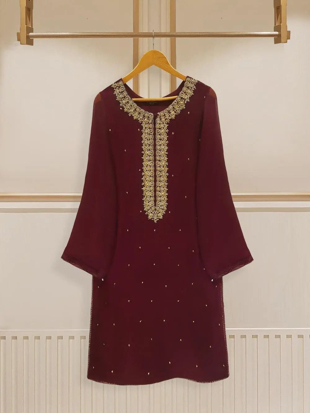 Front view of maroon chiffon dress on hanger