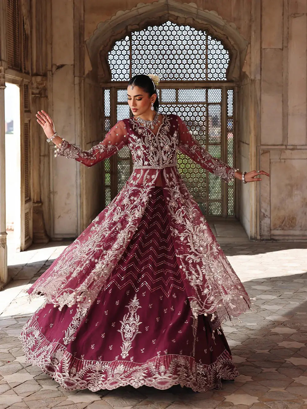 Maroon embroidered lehenga with intricate silver embroidery and sheer dupatta