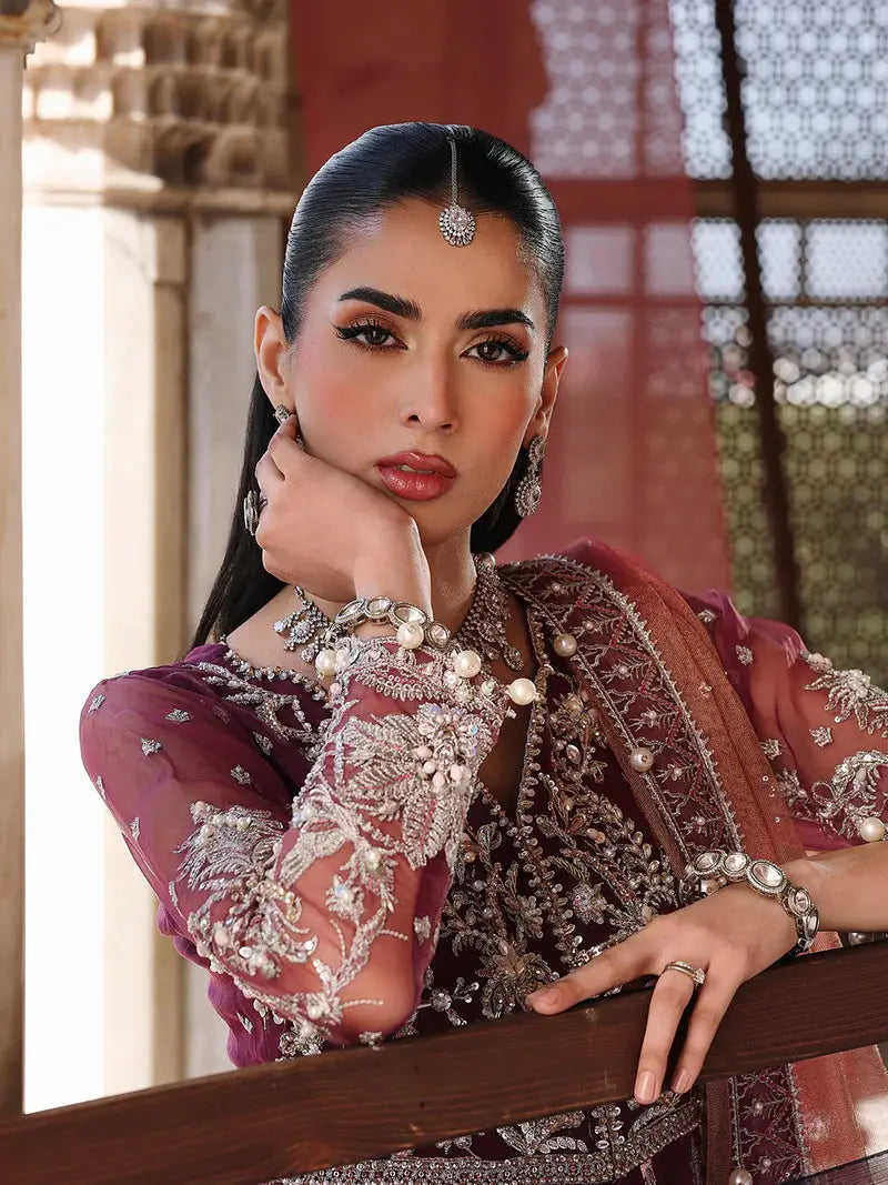 Elegant maroon embroidered dress with pearl jewelry for wedding