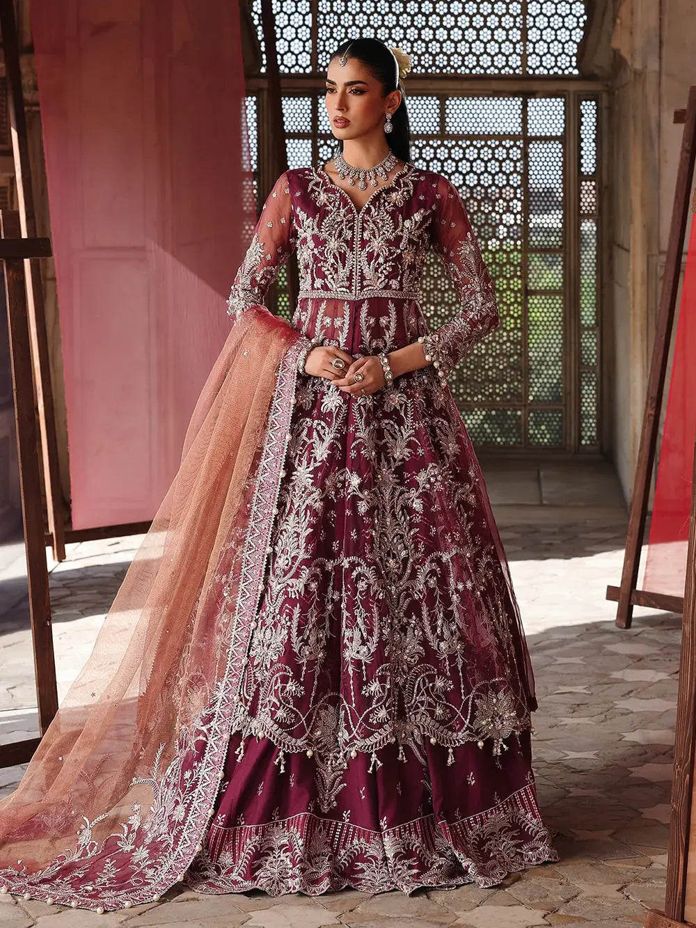 Maroon embroidered lehenga with silver embellishments and peach dupatta