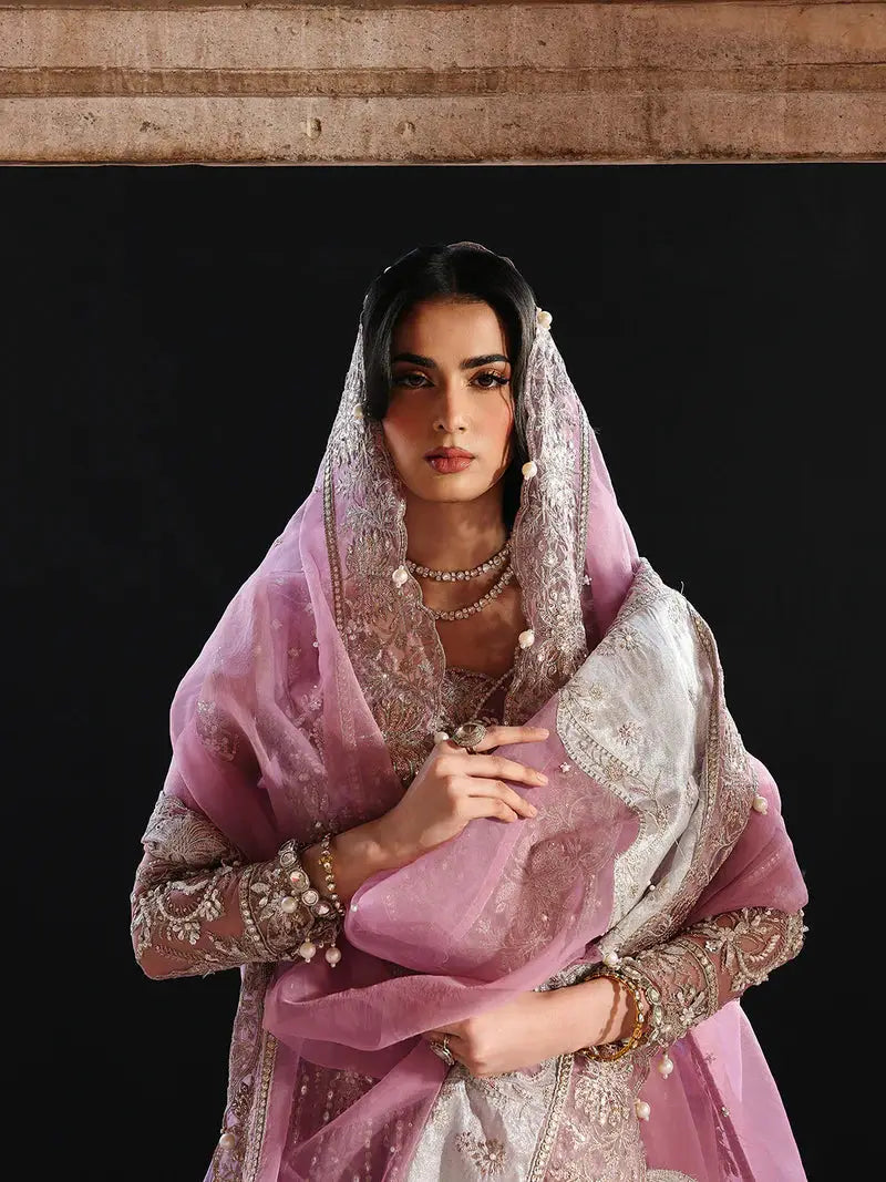 Pink embroidered net maxi with intricate hand-crafted Adda work, crystals, sequins, pearls, and chainwork, paired with organza dupatta and viscose trousers