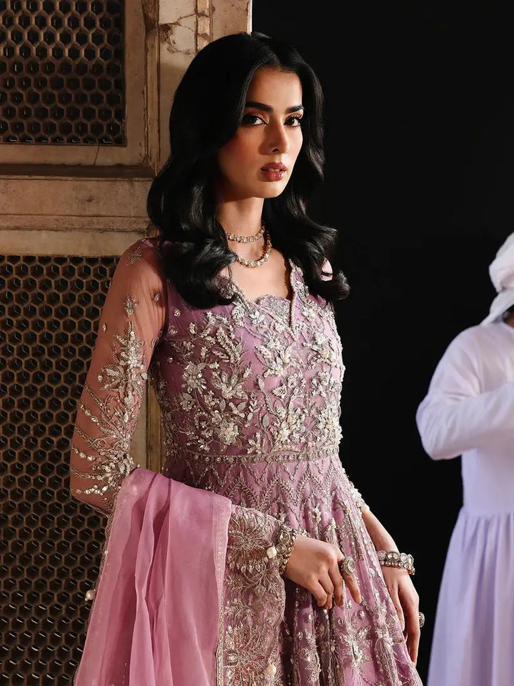 Pink embroidered traditional dress with net dupatta and jewelry