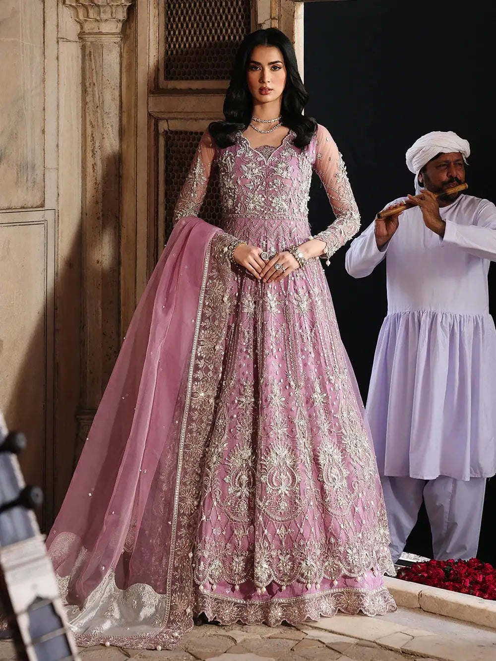 Pink embroidered bridal dress with net dupatta and jewelry
