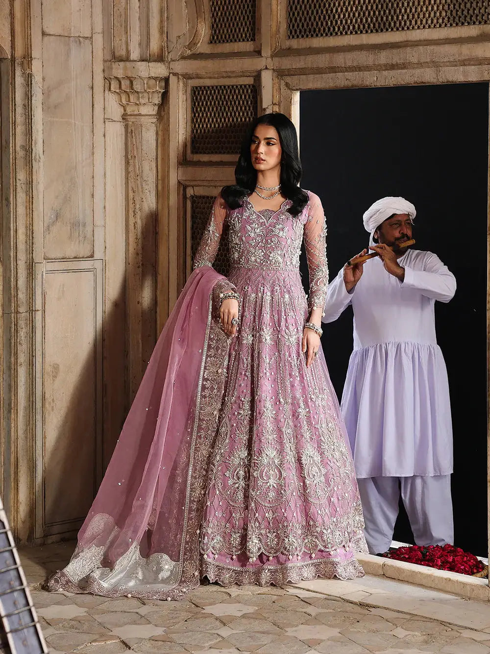 Pink embroidered bridal dress with net dupatta and jewelry