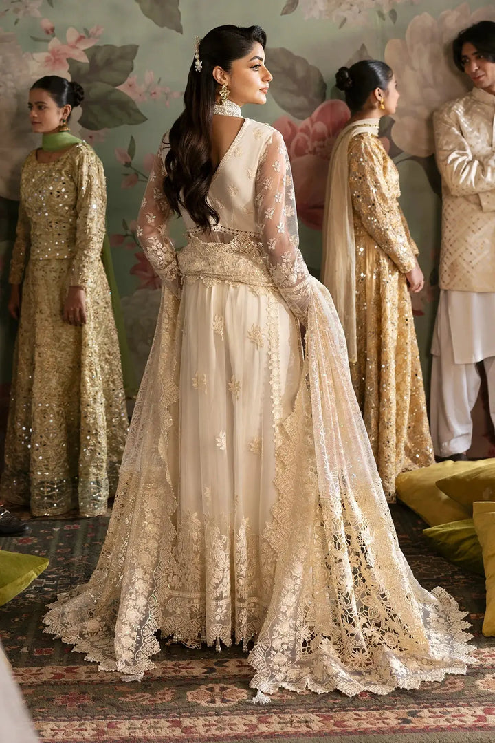 Back view of Luxury Bridals Wedding Formals showcasing detailed lacework and embroidery on a Pakistani marriage dress with flowing dupatta.