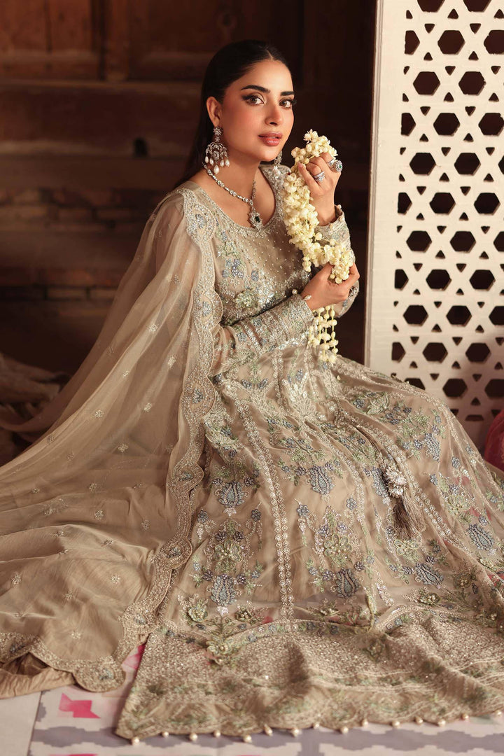 Seated pose in 3 Piece Embroidered Net Suit with detailed embroidery and soft net fabric, ideal for traditional wedding attire.