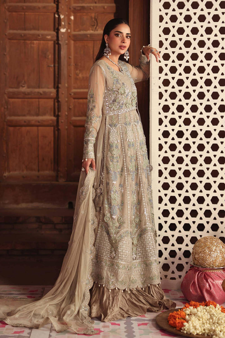 Model posing in 3 Piece Embroidered Net Suit with hand-embellished floral motifs and layered hem, perfect for formal Asian events.