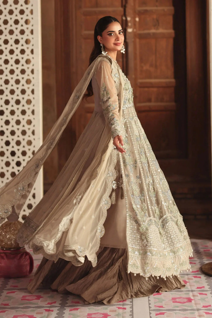 Side twirl of Embroidered Net Suit for Asian Wedding Wear showcasing detailed embroidery and graceful net fabric movement.