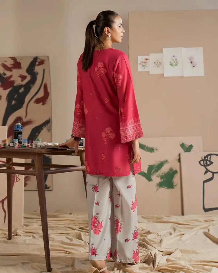 Back view of 2 Piece Outfit EA-24 stitched dress, highlighting the elegant detailing on the pink shirt and floral printed trousers in raw silk fabric.