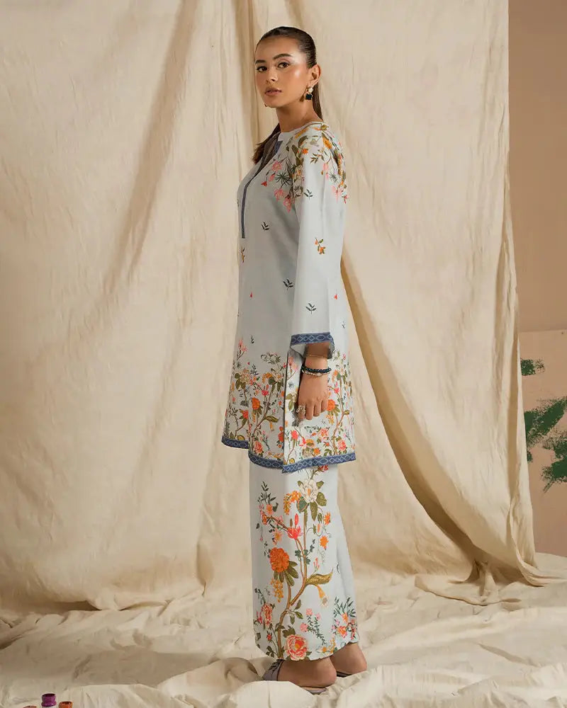 Side view of EA-20 2 piece outfits for women in printed raw silk with floral motifs and relaxed fit, perfect for everyday or semi-formal occasions.