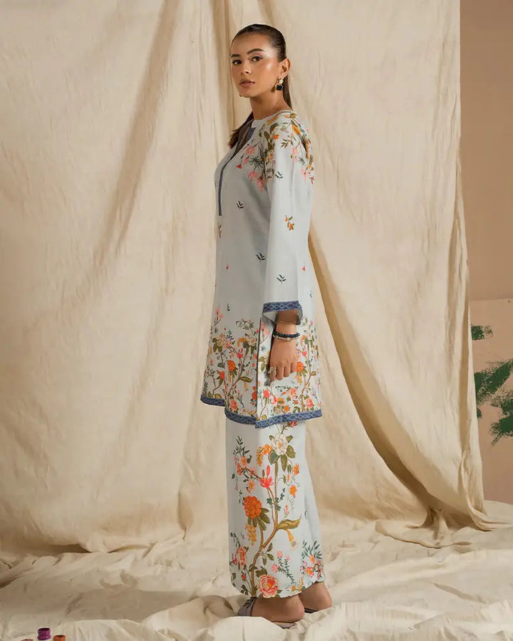 Side view of EA-20 2 piece outfits for women in printed raw silk with floral motifs and relaxed fit, perfect for everyday or semi-formal occasions.