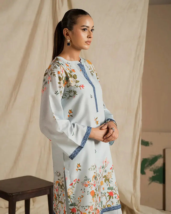 Close-up of EA-20 2 piece outfits for women showcasing intricate floral print and blue detailing on raw silk fabric, designed for elegant daily wear.