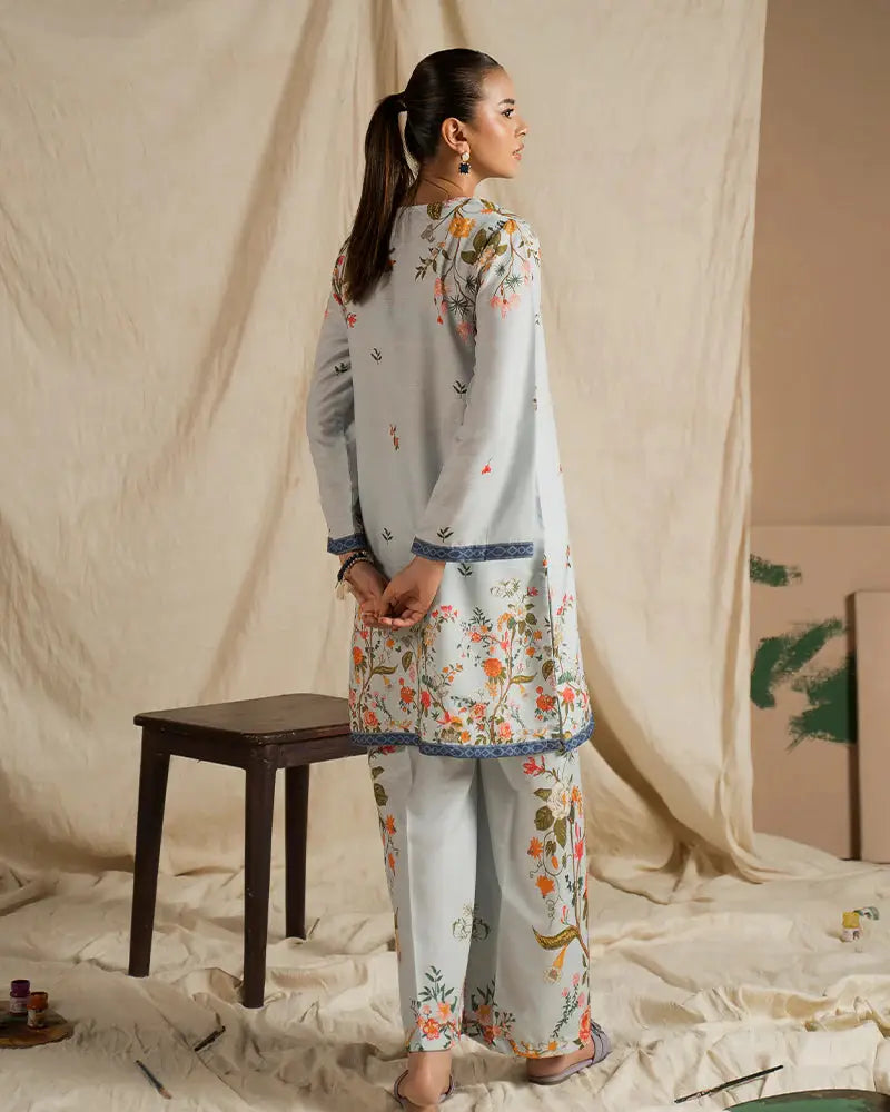 Back view of EA-20 2 piece outfits for women in printed raw silk with floral designs and blue trim, offering a stylish and comfortable co-ord set.