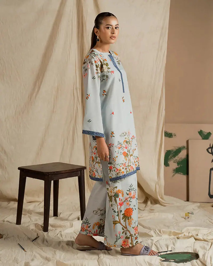 EA-20 2 piece outfits for women in printed raw silk with vibrant floral designs and blue accents, ideal for casual and semi-formal fashion statements.
