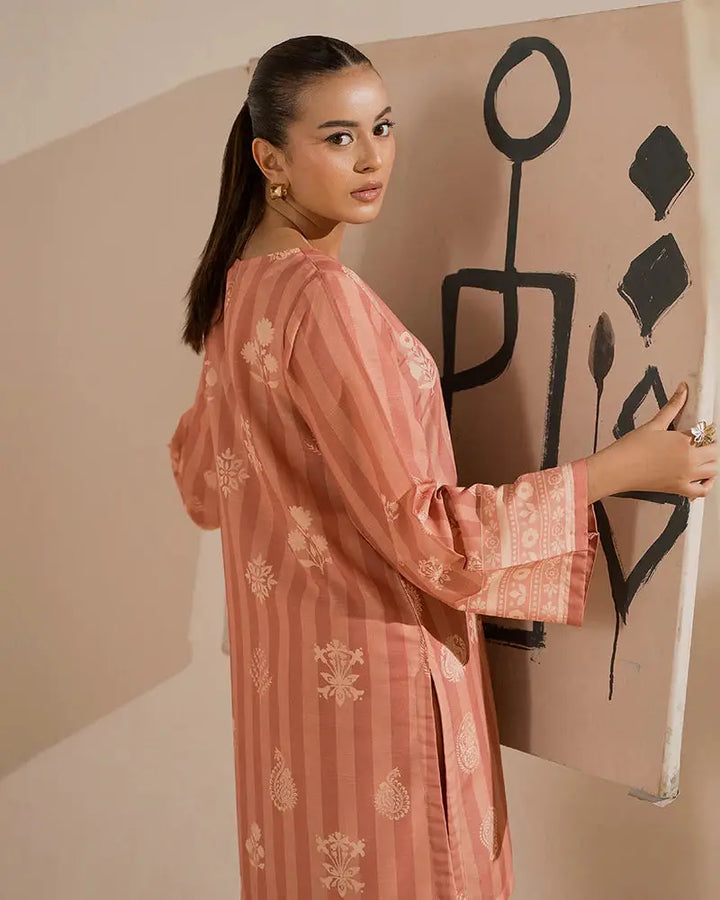 Back view of 2 PIECE OUTFIT - Printed Raw Silk Co-ord | Statement Wear showcasing intricate sleeve and back detailing in peach tones.