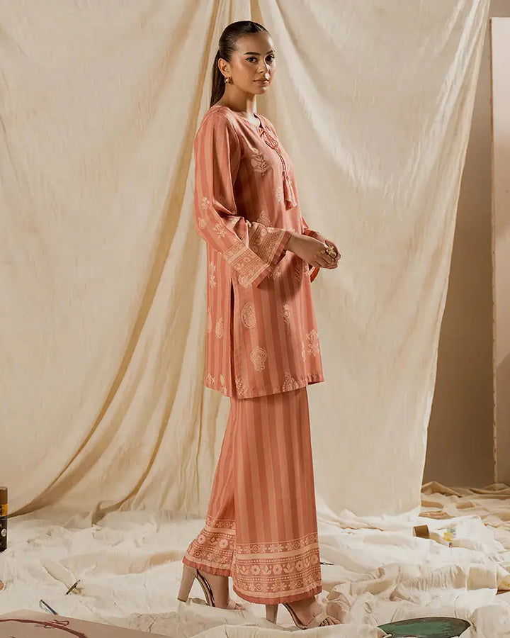 Side profile of 2 PIECE OUTFIT - Printed Raw Silk Co-ord | Statement Wear featuring relaxed fit and detailed hemline for chic comfort.