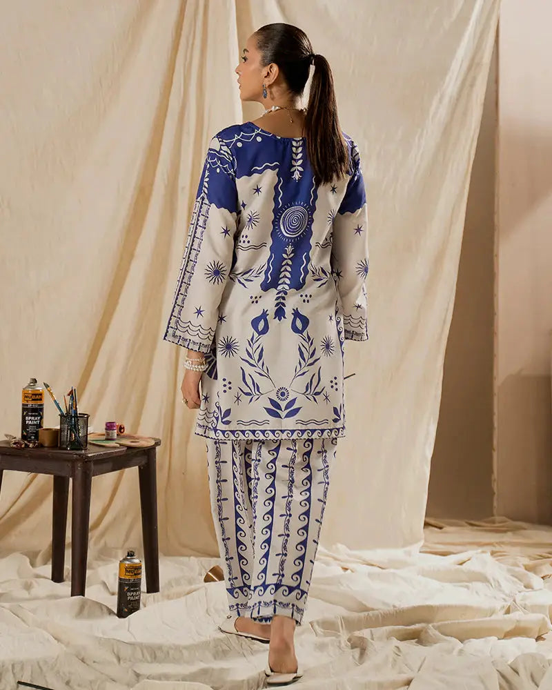 Back view of the EA-17 Raw Silk 2 Piece Outfit with intricate blue motifs on white fabric, perfect for semi-formal or casual occasions.