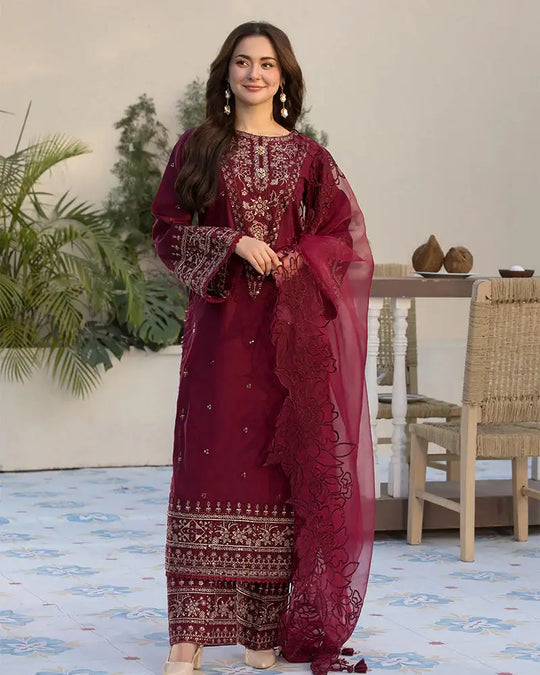 RANGREZA JANAN stitched Pakistani suit in deep maroon, featuring a cotton jacquard shirt with intricate embroidery, paired with an organza dupatta.