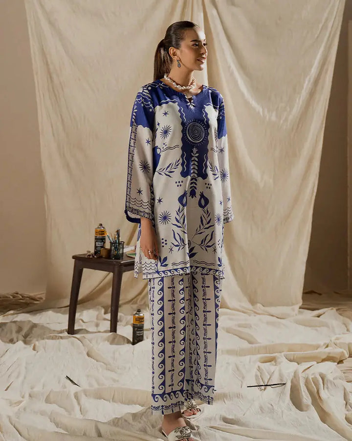Side angle of the EA-17 Printed Raw Silk Co-ord Set, highlighting the flowy silhouette and artistic patterns for fashionable everyday wear.