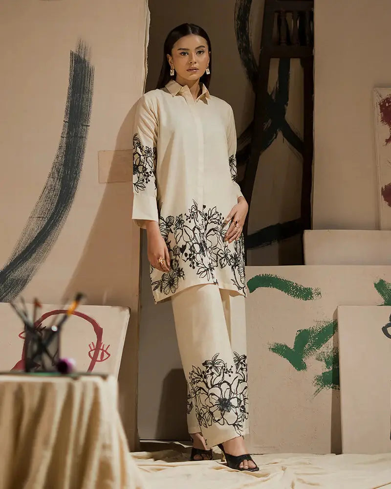 EA-19 Pakistani Eid outfit in cream raw silk with black floral print, a 2-piece shirt and bottom set for festive and semi-formal wear.