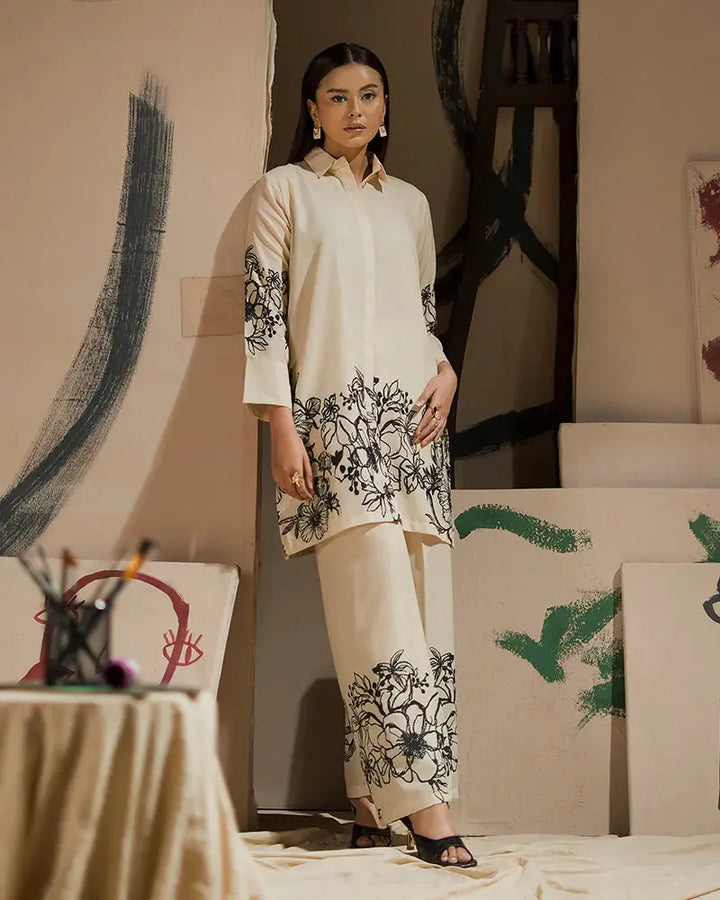 EA-19 Pakistani Eid outfit in cream raw silk with black floral print, a 2-piece shirt and bottom set for festive and semi-formal wear.