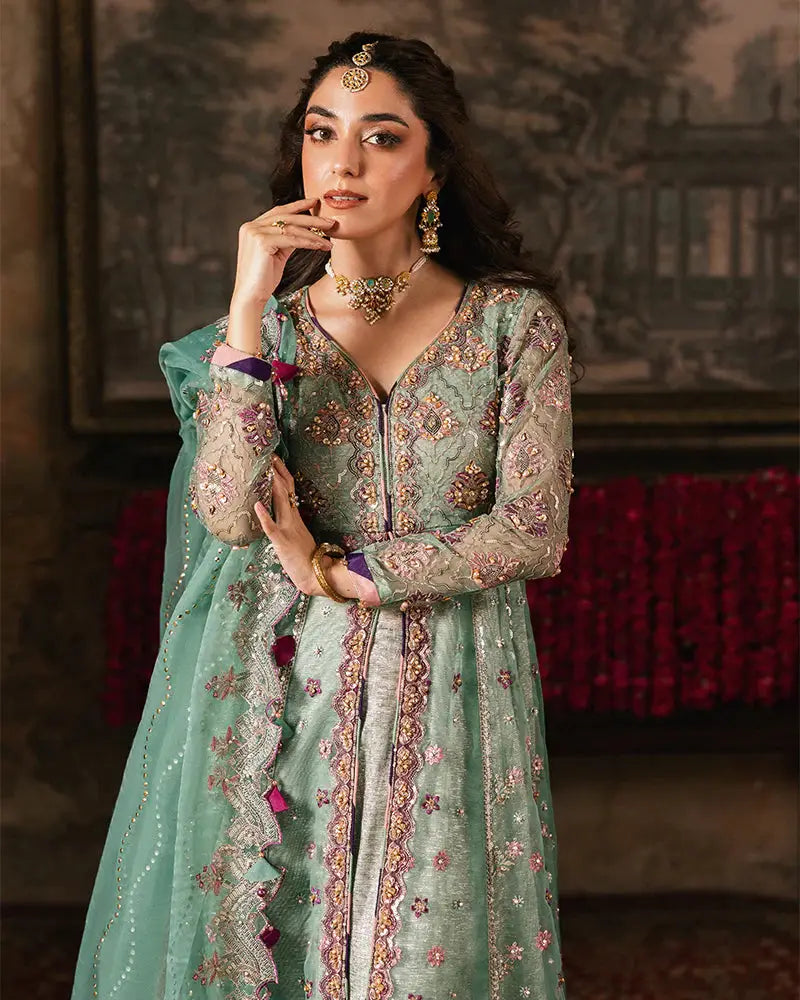 Model wearing RANGREZA ZAHRA AL-4273 formal Pakistani attire with embellished organza shirt, matching dupatta, and traditional jewelry.