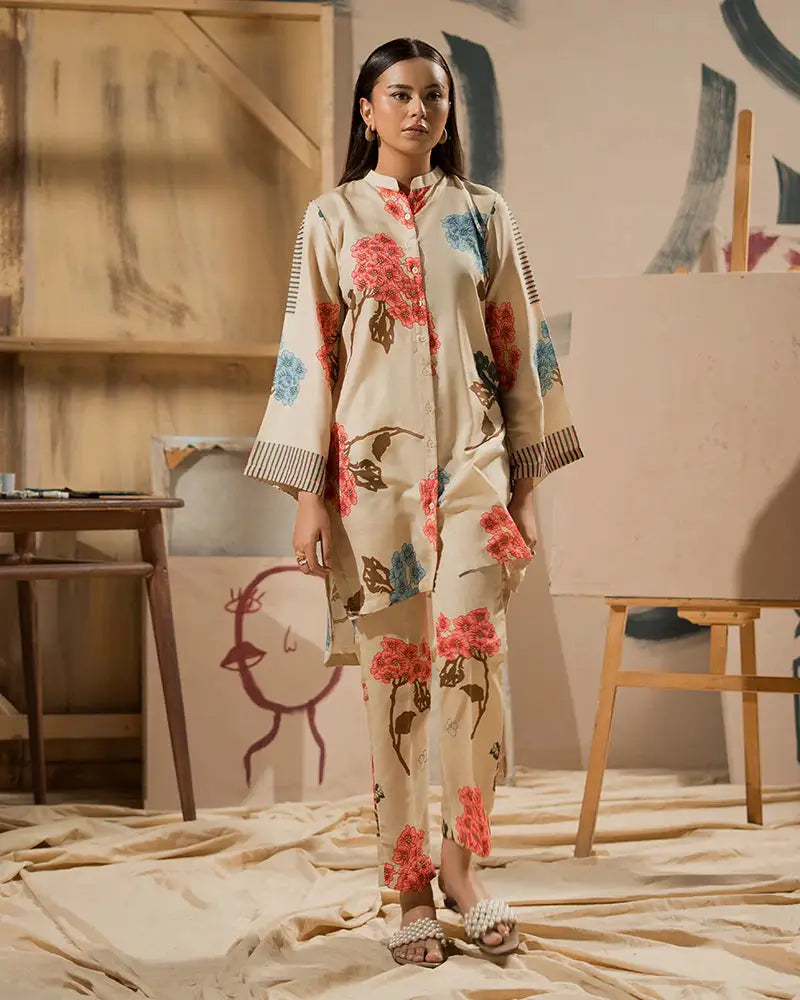 Pakistani Outfits - Printed Raw Silk Co-ord Set | 2 Piece Outfit featuring a beige shirt and bottom with red and blue floral prints. Ideal for casual wear.
