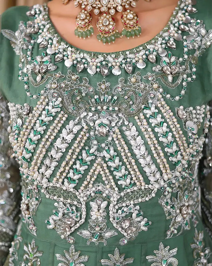 AROOSH Organza Maxi - Pakistani Asian Clothes | Embellished Dress detailed embroidery close-up with pearls, sequins, and seashells.