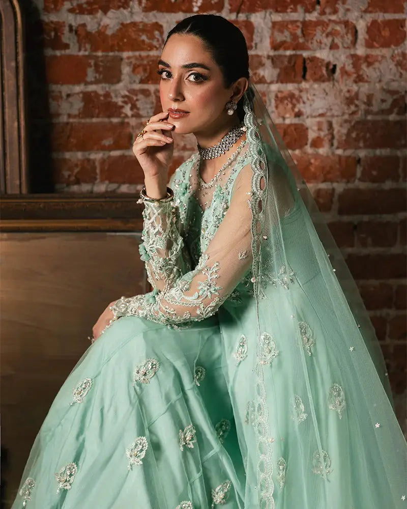 Close-up of Rangreza JANNAT AL-4270 dress highlighting delicate embroidery, sheer sleeves, and luxury net dupatta with lace border.