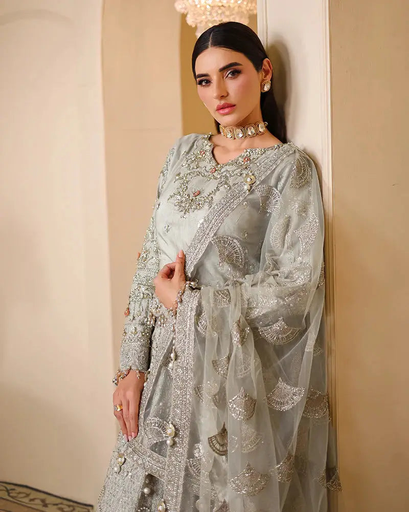 AROOSH WEDDING WEAR Pakistani bridal clothes with sheer embroidered dupatta, silver sequins, and delicate tilla work on Raw Silk Choli.