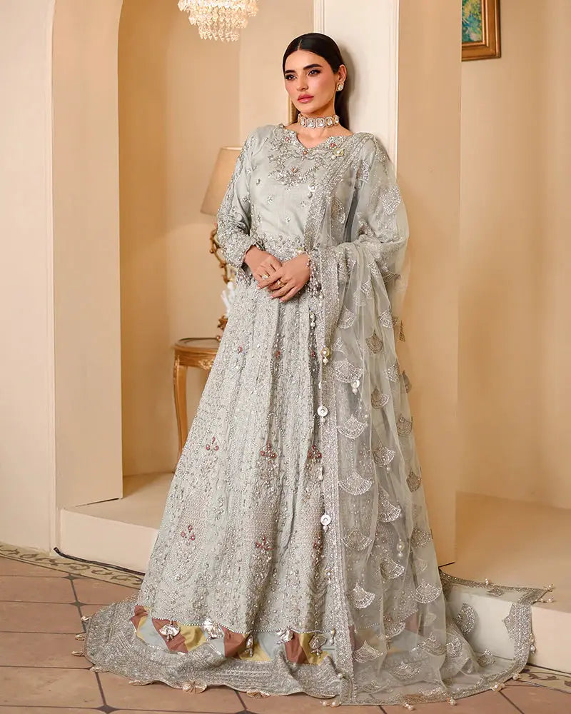 Full front view of AROOSH WEDDING WEAR bridal outfit with Raw Silk Choli, lehnga, and dupatta adorned with pearls, tassels, and intricate embroidery.