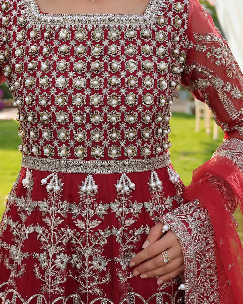 Front bodice embroidery of AROOSH AR-148-1800 with pearl clusters and floral threadwork on red organza, styled for wedding wear.