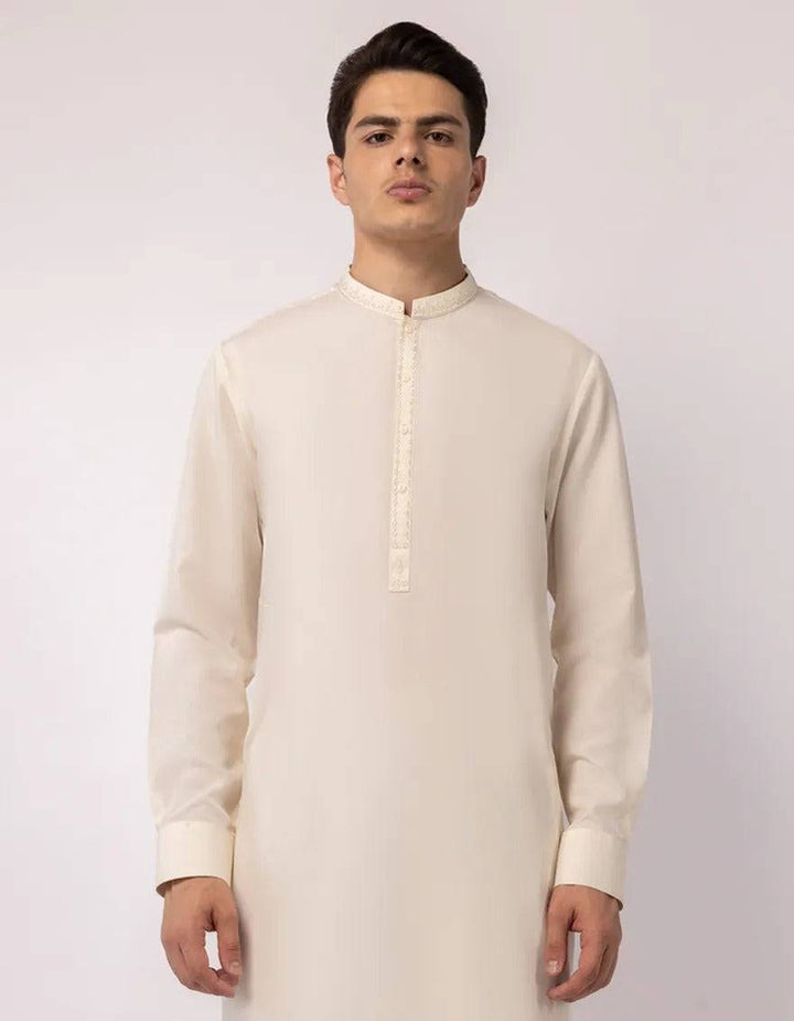 Close-up of men's cream kurta with embroidered collar