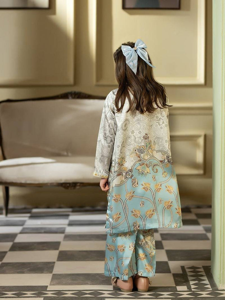 Back view of girl in Rangreza Silk 2 Piece with bow hair accessory