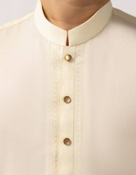 Close-up of J. Semi Formal Kameez Shalwar neckline with metallic buttons and embroidered placket, ideal for boys ethnic party wear.