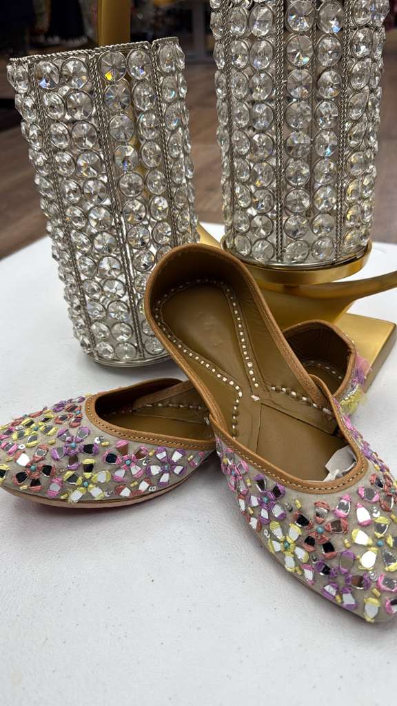 Sheesha Golden Jutti with vibrant mirror work in pink, yellow, and purple tones. Traditional Pakistani khussa perfect for celebrations and cultural wear.