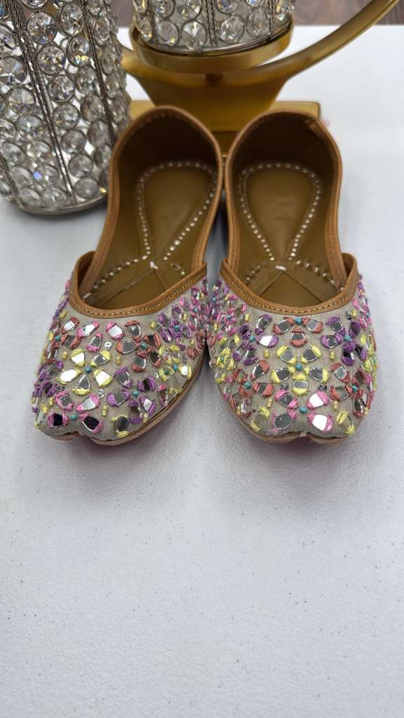 Shop Sheesha Golden Jutti - Khussa Mirror Design featuring multicolor mirror embellishments on beige fabric. Ideal for festive and dance occasions.